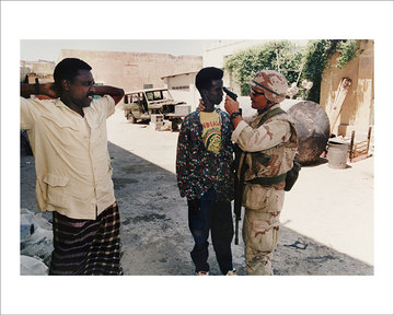 U.S. Marine points a pistol at a 15-year old
