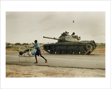 A U.N. tank force looks on